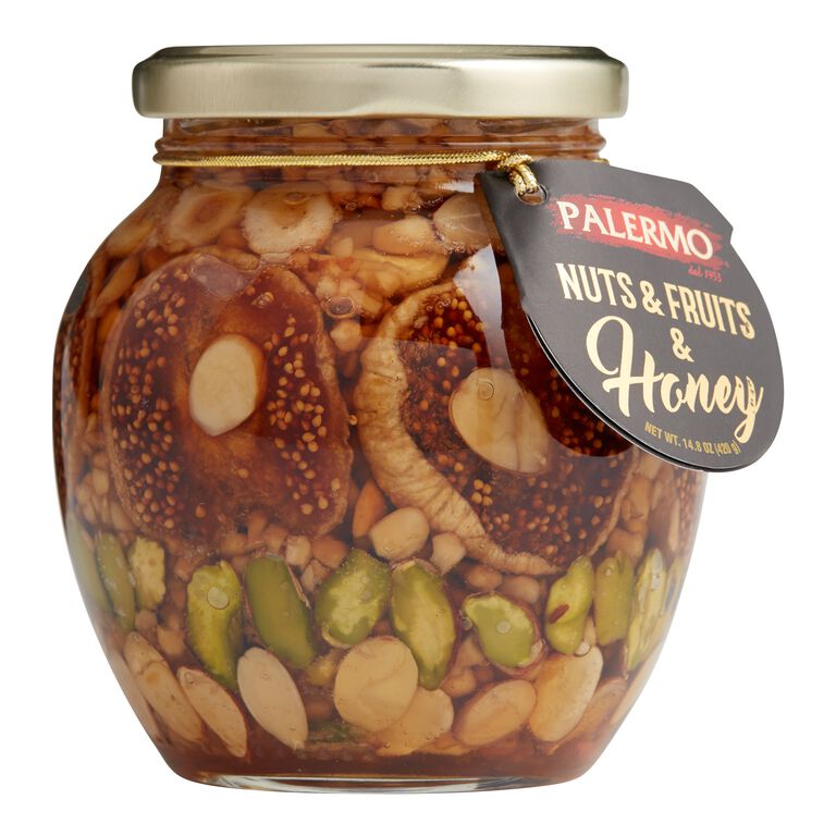 Glass jars with honey and nuts. Almonds and hazelnuts in honey in